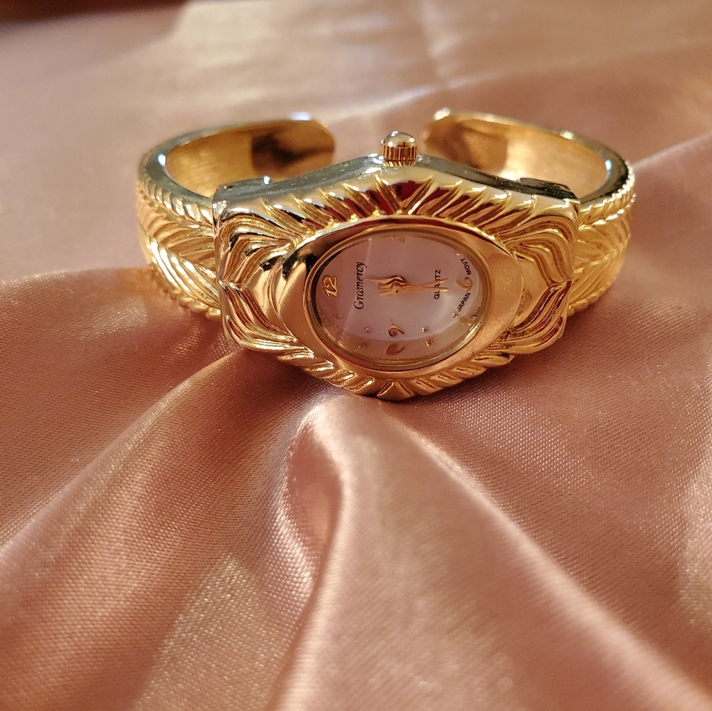 Goldtone bangle watch